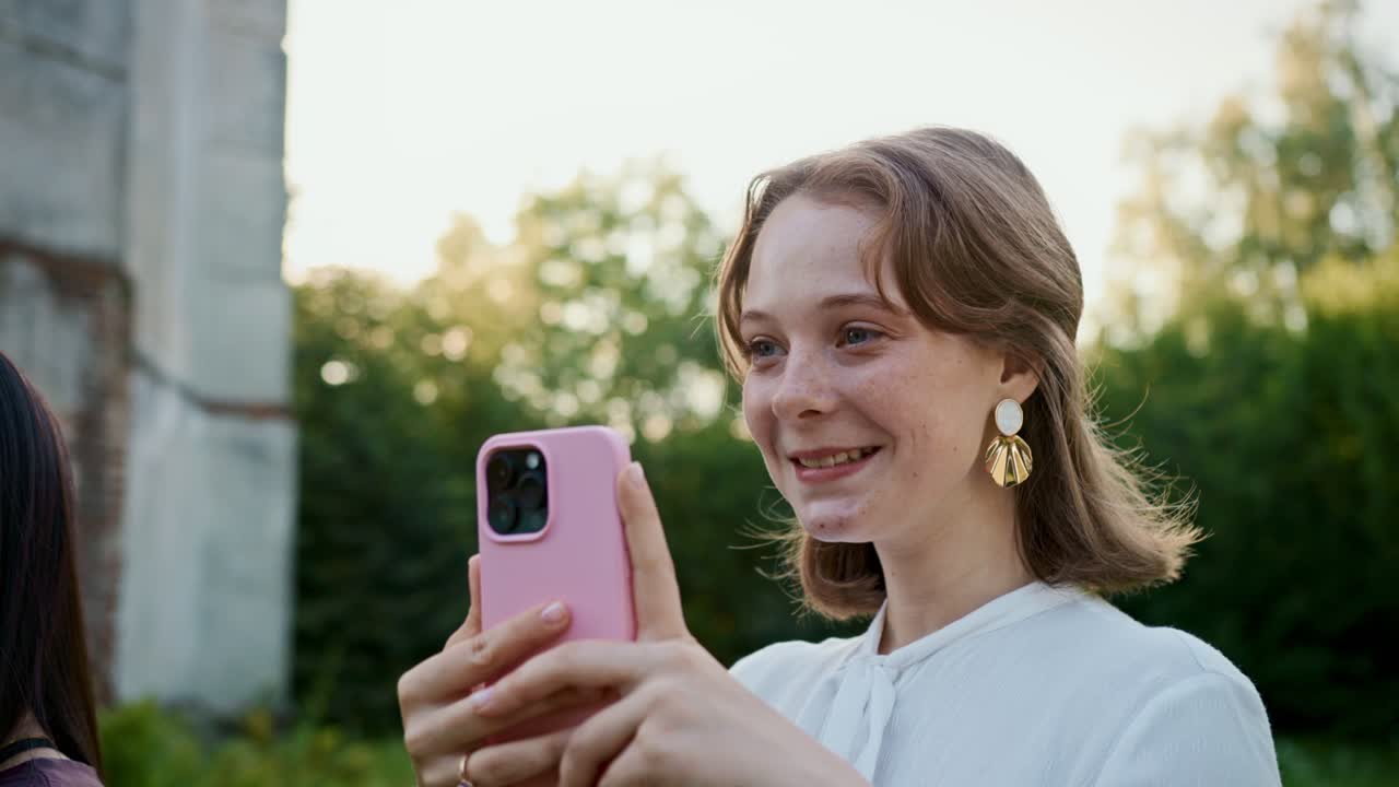 Woman taking a picture with a smartphone