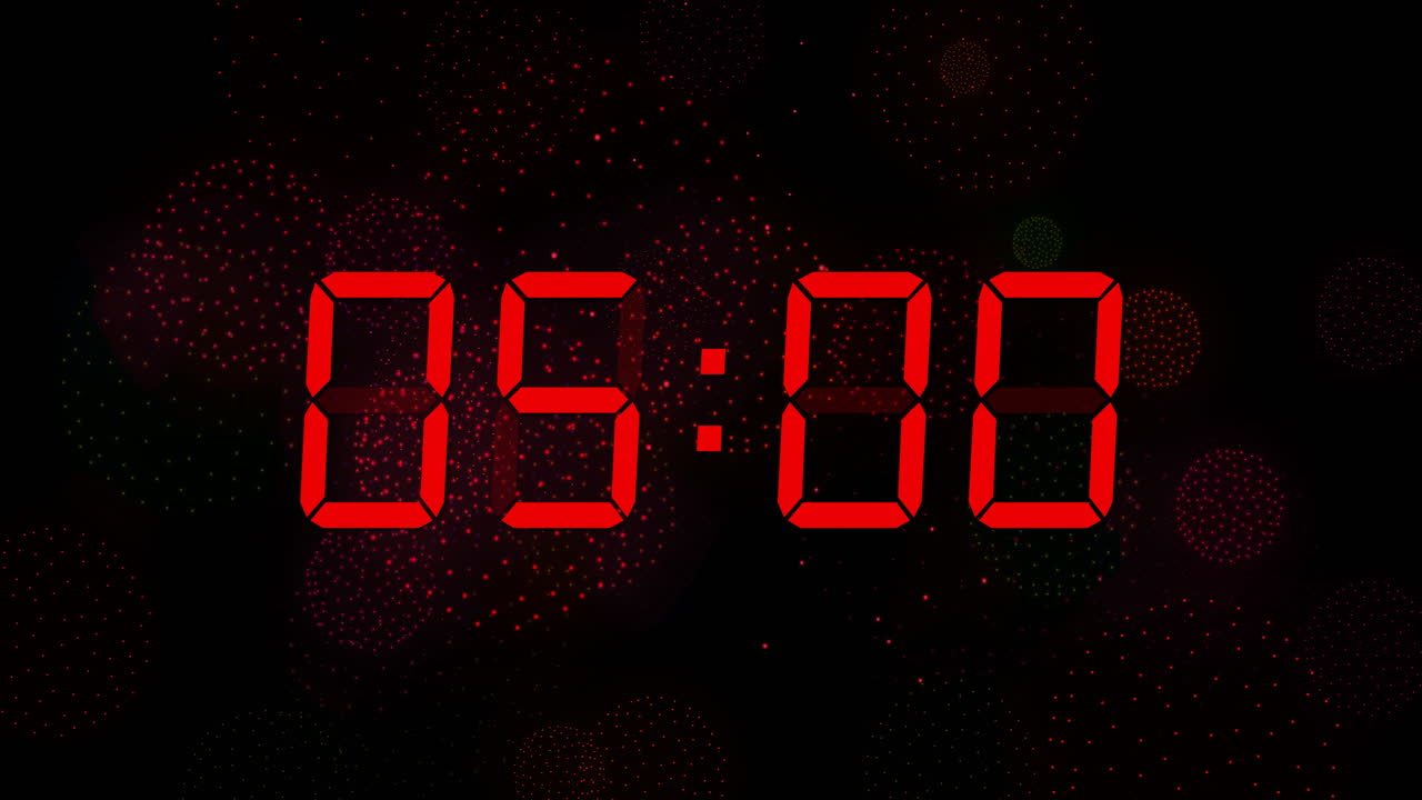 Animation of digital clock counting down to midnight on black background