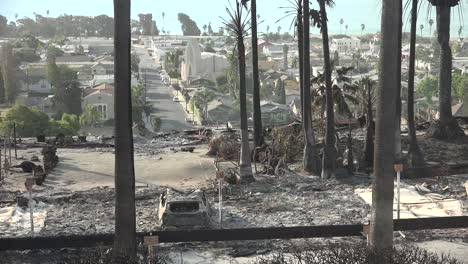 the destroyed remains of a vast apartment complex and charred vehicles overlooking the city of ventura following the 2017 thomas fire