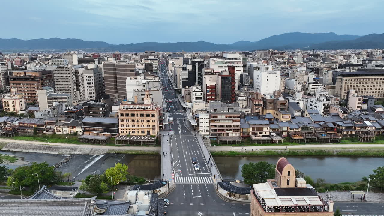 Riverside Buildings Along The Komo River With Shijo Bridge In Kyoto, Japan. - aerial shot