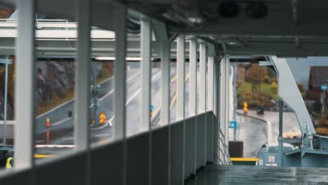 A-passenger-ferry-arriving-at-Hella-terminal,-rising-bow-visor-and-docking