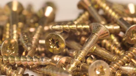 metal screws in the furniture workshop rotate in a circle use of fasteners when working with wood metal screws in the furniture workshop rotate in a circle use of fasteners when working with wood macro video