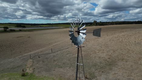 course lock shot of windmill at farm, margaret river region, western australia