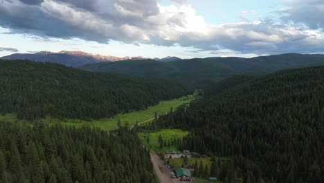 flying over rural community and dense woodland in