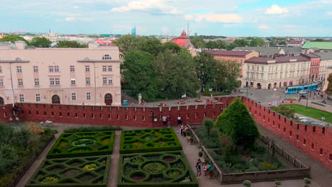 visitors resting at the beautiful landscaped royal garden of wawel in krakow, poland