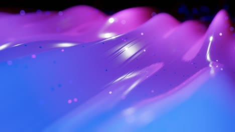 abstract 3d surface with beautiful waves, luminous sparkles and bright color gradient blue purple. waves run on very shiny, glossy surface with glow glitter. 4k looped animation