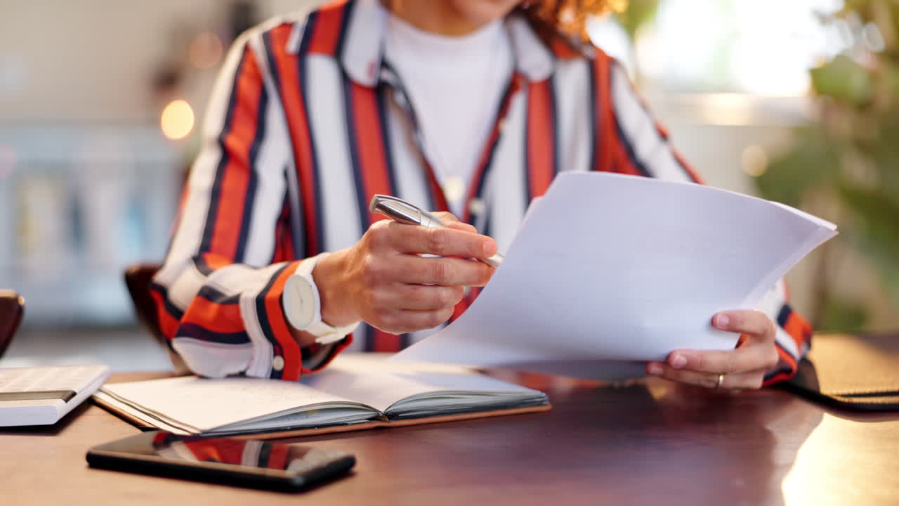 Woman working on paperwork at her desk