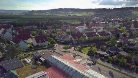 A-limousine-is-driving-through-a-roundabout-and-drives-further-away-into-the-sunset-in-Switzerland