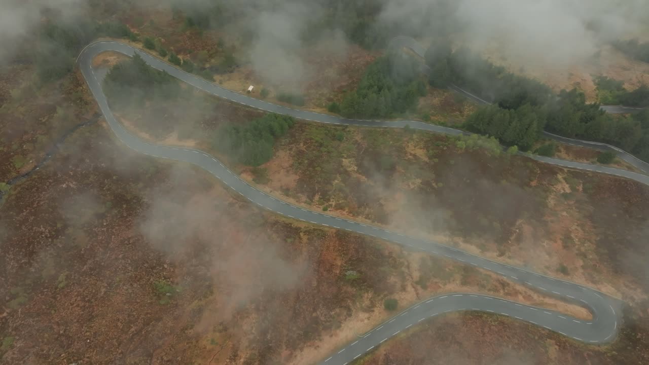 Winding road in in Norway. Flying over the clouds