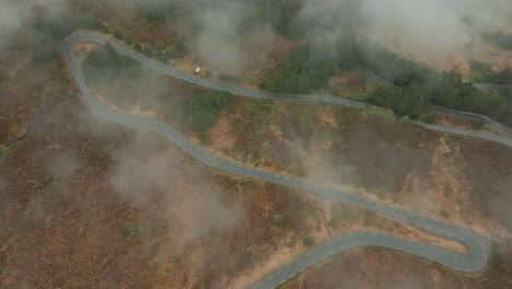 winding road in in norway. flying over the clouds