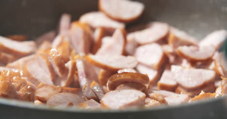 Sausage-Cuts-Frying-On-Pan-2