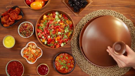 moroccan cuisine top view. tajine, traditional dish made of lamb and eggplant, vegetable salad. middle eastern culture. couscous with mutton close-up, delicious rice. homemade food.