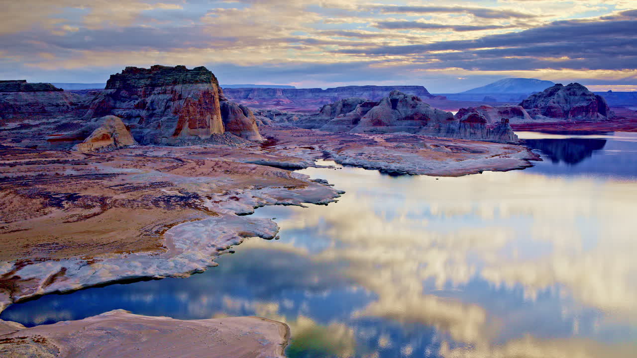 A mesmerizing drone shot showcasing the otherworldly desert and striking red rock formations near Lake Powell.