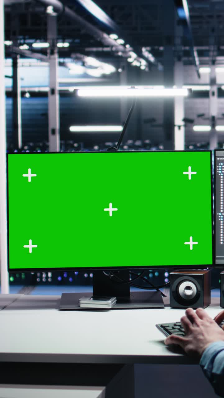Vertical video Data center engineer managing AI systems for uptime using mockup PC