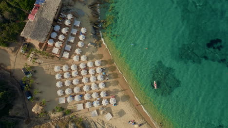 aerial view of a beautiful beach with clear turquoise water and beach bar
