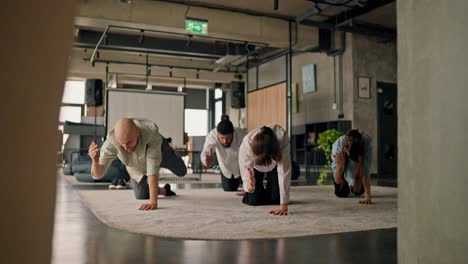office employees doing yoga exercises