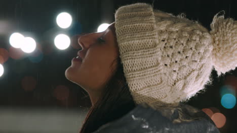 woman enjoying rain at night