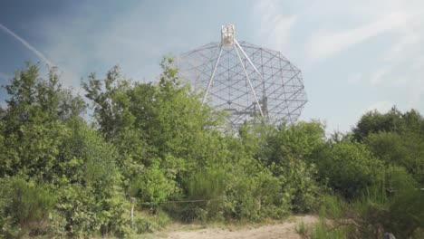 large radio telescope in a park