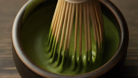 close-up of matcha tea being whisked