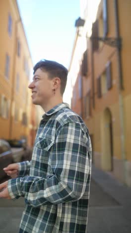 man walking in a european city street