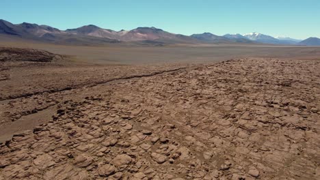 aerial rises over rugged expansive rocky altiplano in high bolivia