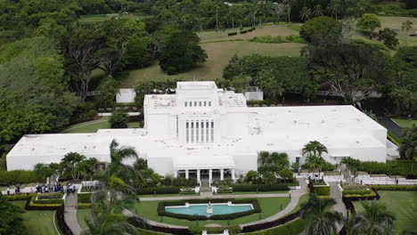 Aerial-parallax-around-large,-ornate-Laie-Hawaii-LDS-Temple,-Oahu,-Hawaii