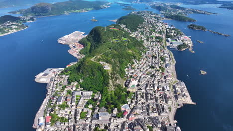 aerial view of alesund, norway, scenic city on islands, buildings and coastline, drone shot