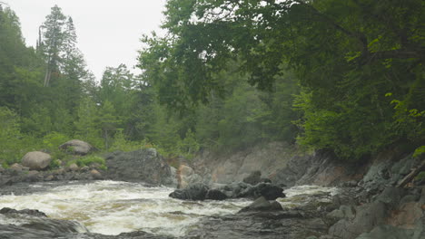 the batchawana river flows over some rapids toward the falls