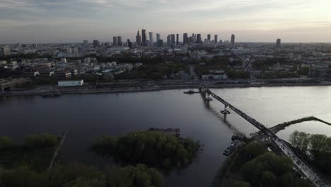 Golden-Hour-View-of-Busy-Warsaw-Streets-and-Agrafka-Bridge-by-River