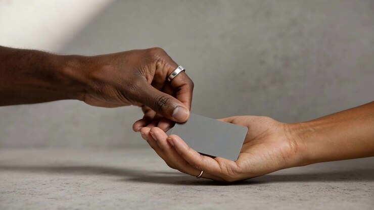 Dark-skinned hand lowering grey card into open palm then releasing and withdrawing, AI-generated