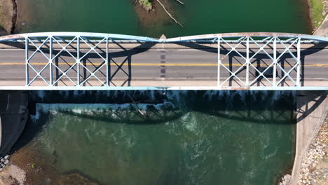 top down aerial of bridge over river water