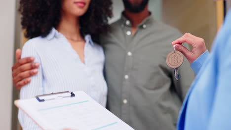 realtor, couple and homeowner with keys