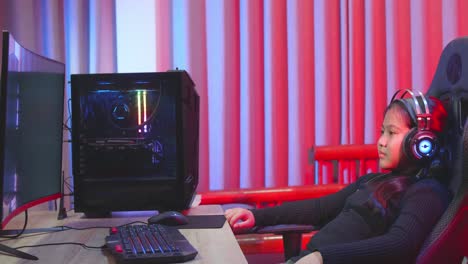 young gamer girl playing video games