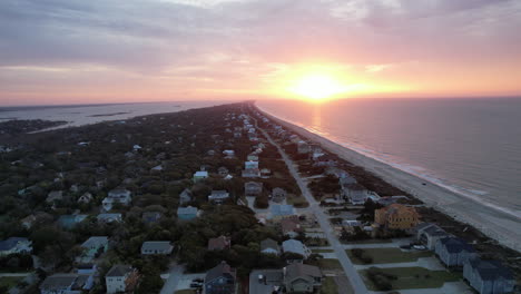 aerial shot of sun rising over the ocean in emerald isle, nc