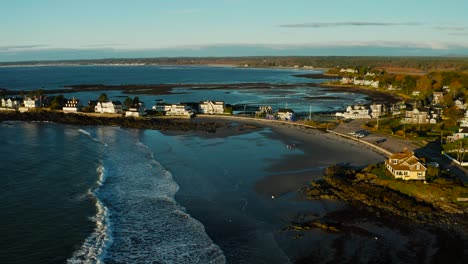 rising aerial of exclusive homes along rocky maine coast