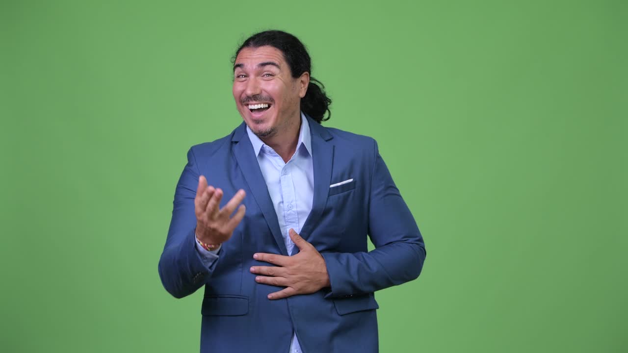 Happy handsome businessman laughing