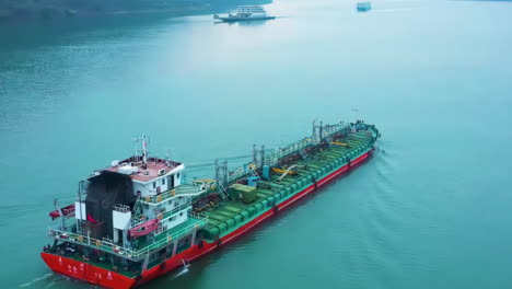 Close-up-view-of-cargo-ship-sailing-bulker-is-a-merchant-ship-specially-designed-to-transport-unpackaged-bulk-cargo,-such-as-grains,-ore,-coal-or-timber