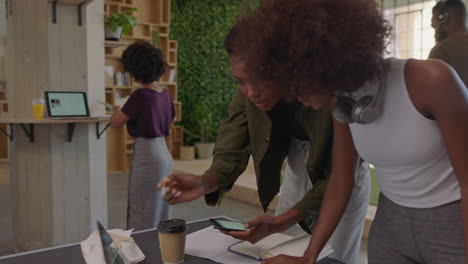 successful black business women brainstorming creative team sharing ideas enjoying collaborating colleagues working together in trendy office workplace