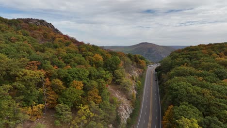 an aerial view high above the mountains in upstate ny during the fall foliage changes