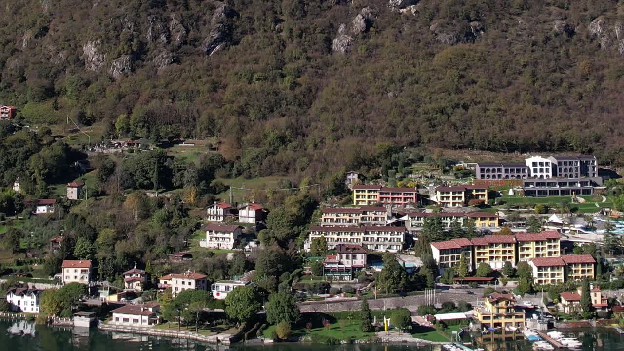 Stunning aerial view of Italian Alps town nestled in green hills