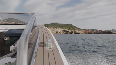 slowmotion of the bow of a luxury boat, and the backgroud in focus, ibiza, spain