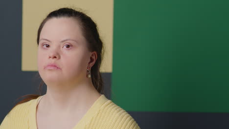 studio portrait of girl with down syndrome