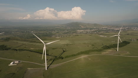 turbine generators in wind in agricultural area in gori, georgia