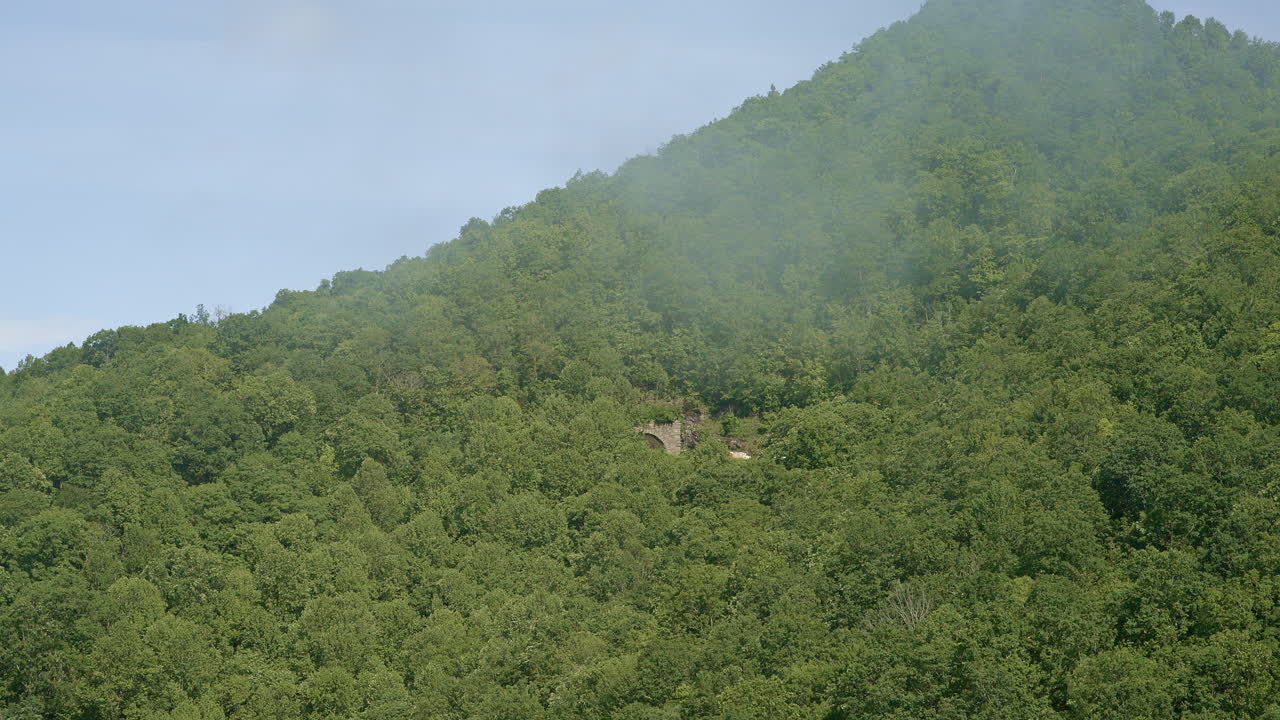 Fog rolls gently across the Smoky Mountain wilderness in this aerial