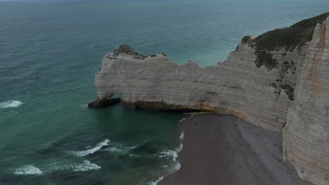 Wide-Shot-of-France-Nature-Cliff-in-Dark-Blue-Ocean-on-overcast-Sky-Day,-Aerial-forward