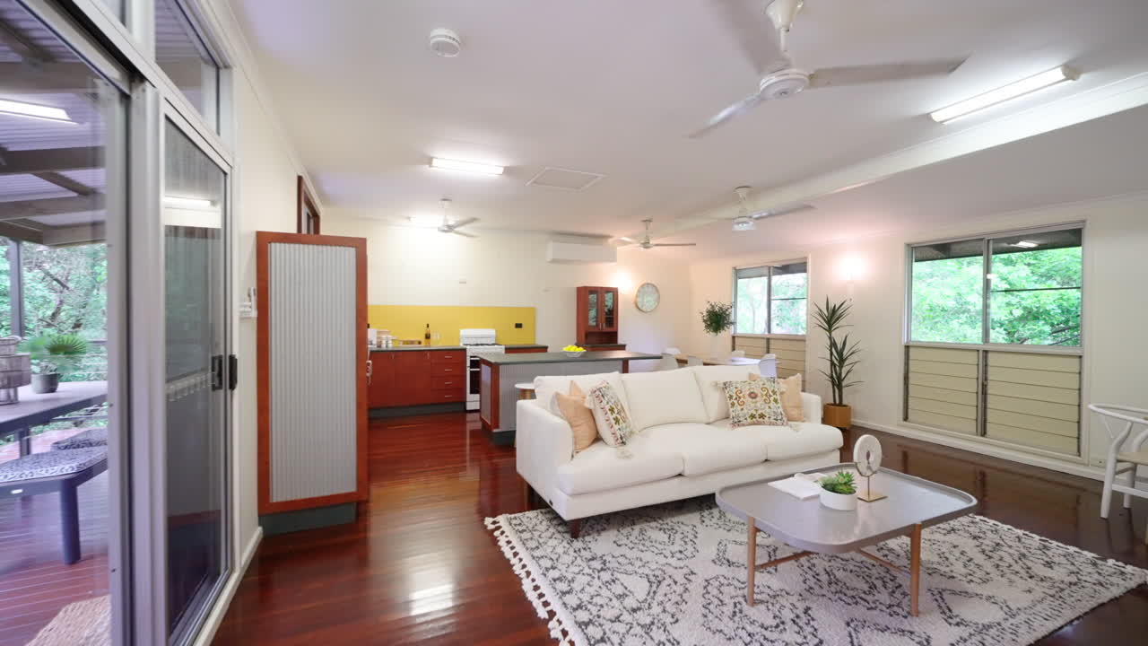 A modern open-plan living room and kitchen interior