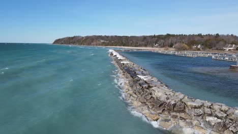 Leland stone breakwater on sunny winter day, aerial view