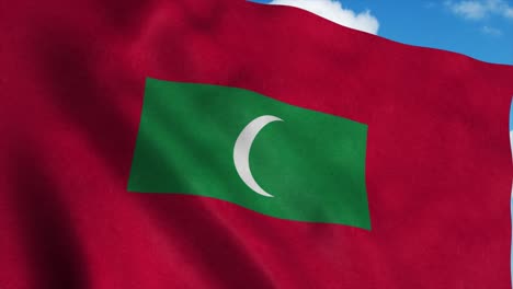 republic of maldives flag on a flagpole waving in the wind, blue sky background. 4k