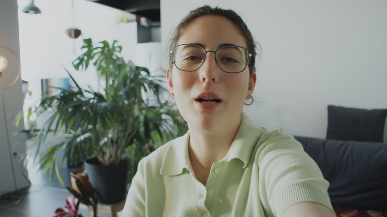 Female Blogger Filming Video at Home