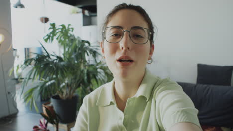 female blogger filming video at home